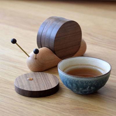 Schwarze Walnuss-Coasters Kreatives Schneckendesign Holz Isolationsschüssel Moderner Stil