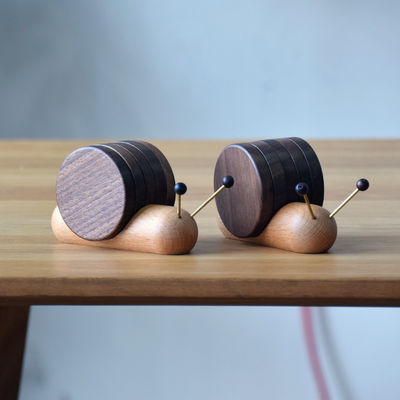 Schwarze Walnuss-Coasters Kreatives Schneckendesign Holz Isolationsschüssel Moderner Stil